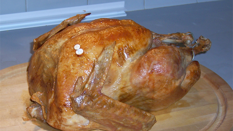 Golden roasted smoked holiday turkey with fruitwood pellets
