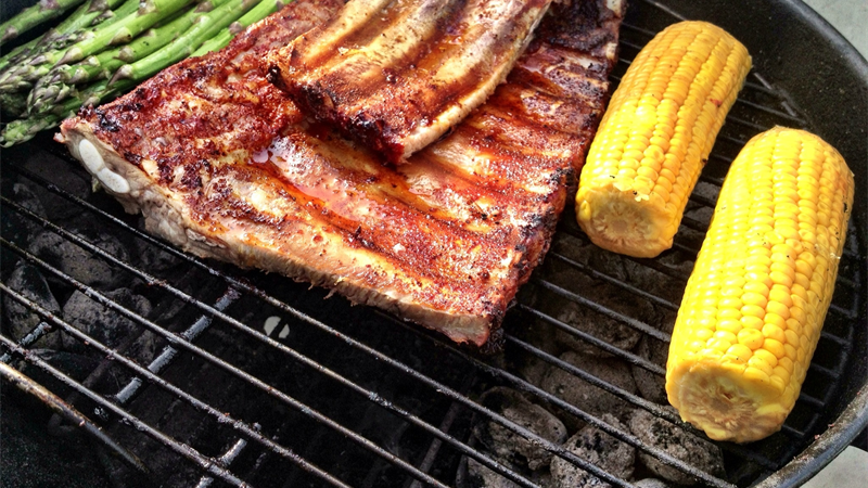 Pit Boss Austin XL cooking racks of smoked barbecue ribs
